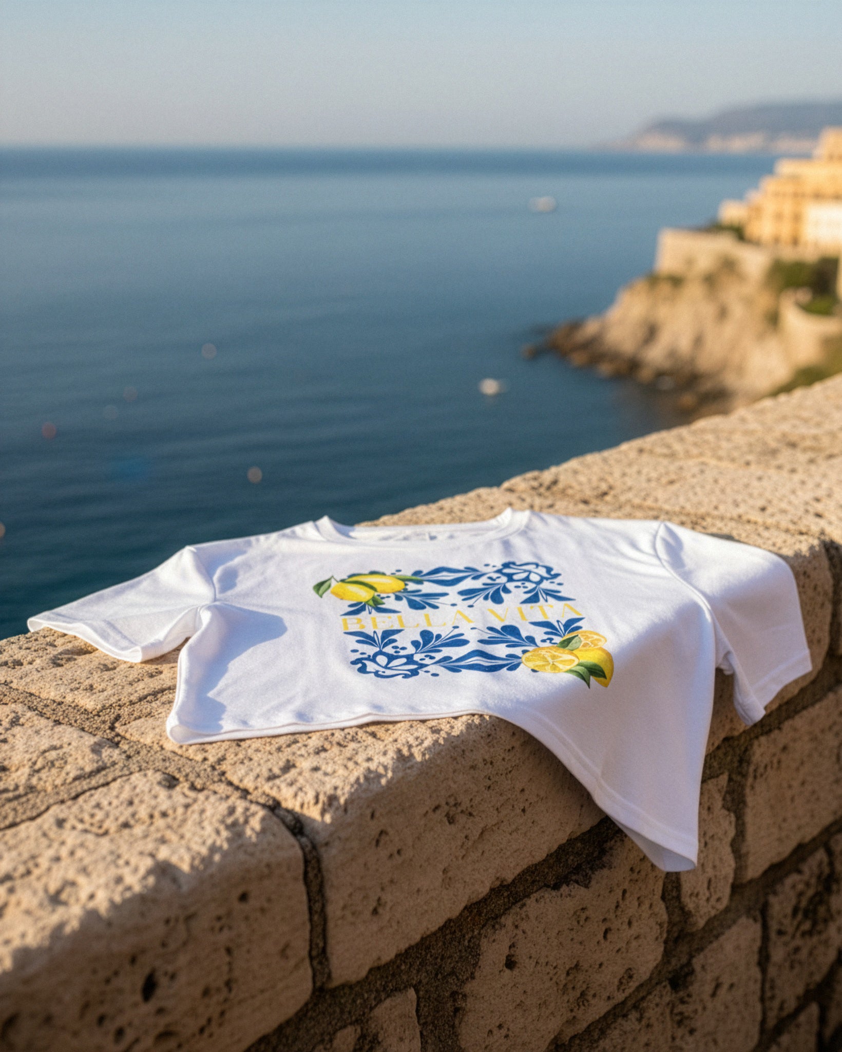White La Bella Vita Lemon Graphic Crop Top by UniqueVisuals featuring a Mediterranean lemon print